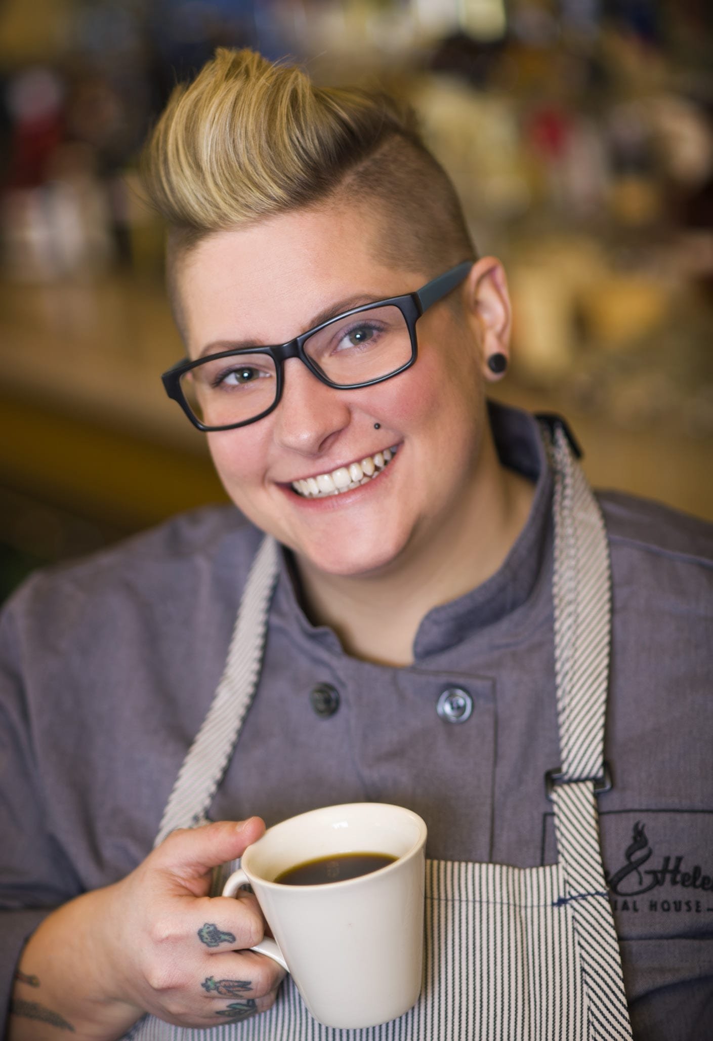 Maria Wunderlin, executive chef at Rack & Helen’s Social House Fort Wayne holding a cup of coffee